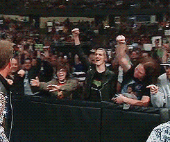Mikey Way and Ray Toro are ringside at a WWE RAW show. Jericho is approaching them and Ray Toro attempts to high five him but he misses